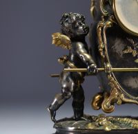 Auguste MOREAU (1834-1917) Gilt and silvered bronze clock and two candlesticks with putti decoration, signed Aug. Moreau, 19th century.