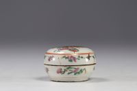 China - A famille rose porcelain covered box decorated with characters.