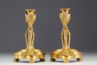 A rare pair of Louis XVI style ormolu candlesticks with swans, first half of the 19th century.