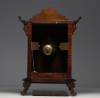 Carved exotic wood clock in the style of Gabriel Viardot with chinoisant decoration, elephant head feet, 19th century.