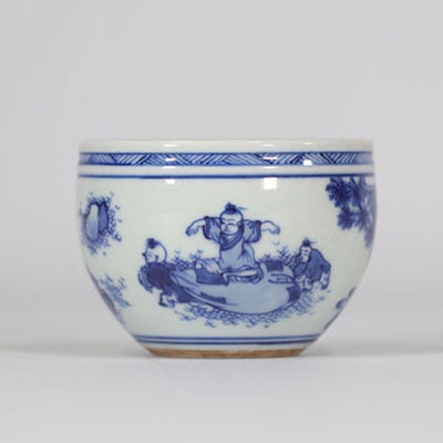 Blue and white pot decorated with a laughing Buddha and playing children