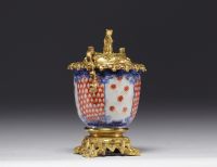 A Chinese porcelain money box with an ormolu squirrel from 18th century