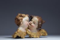 ‘Two heads of cherubs’ Polychrome wood carving, 18th century.