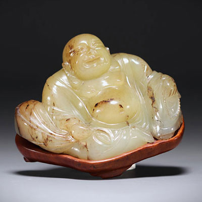 China - Green/brown jade Buddha on base.