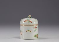 China - Small covered pot enclosing a cup in famille rose porcelain decorated with butterflies.