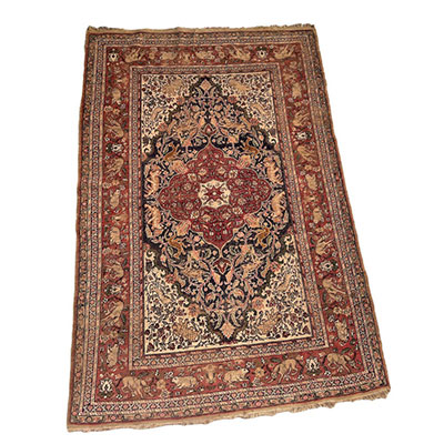 Antique Persian rug with animal and warm tone decoration