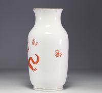 Meissen - Porcelain vase decorated with orange dragons on a white background.