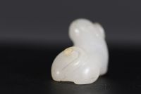 China - Small white jade pendant representing a cat, 18th century.