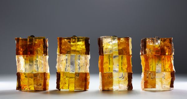 Jean Simon LABRET (20th century) Suite of four Brutalist sconces in orange glass.