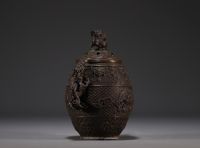 China - Bronze perfume burner decorated with dragons, lid surmounted by a Fô dog.