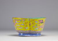 A Famille Rose porcelain bowl decorated with imperial red dragons on a yellow ground with the mark and of the Tao Kuang period (1821-1850)