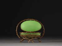 A Napoleon III period egg-shaped jewellery box in green opaline Palais Royal with brass mount.