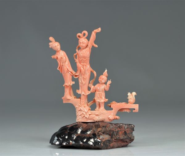 Pink coral sculpture of young women and children from China during the Republic period