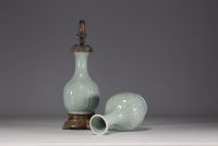 China - A celadon porcelain oil lamp and shaft decorated with flowers and bamboos, 18th-19th century.