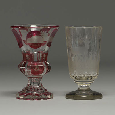 Bohemia - Pair of engraved glasses, one with a deer design and one in multi-layered glass with a city design.