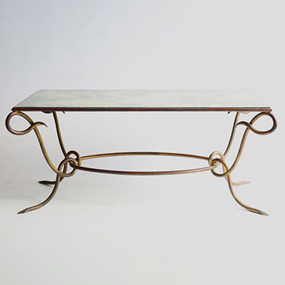 René DROUET (1899-1993) Gilded wrought iron coffee table with eglomised glass top, circa 1940