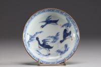 Chine - Ensemble de quatre bols et assiettes en porcelaine polychrome à décor floral et canards.18eme