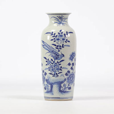 White and blue porcelain vase decorated with birds and flowers