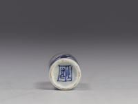 China - white and blue porcelain snuffbox decorated with characters.