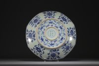 China - Large blue-white porcelain dish decorated with a five-clawed dragon and a phoenix.