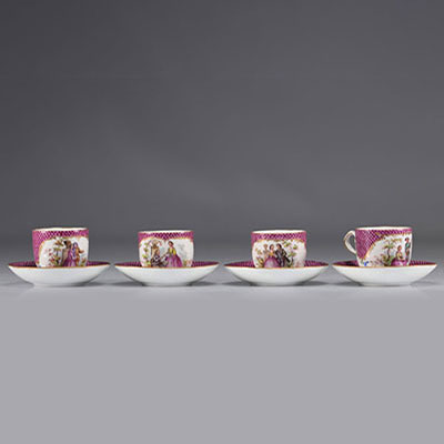 Meissen porcelain cups and saucers decorated with romantic scenes in red on a white background