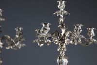 A pair of Louis XV style silver-plated bronze candelabras, 19th century.