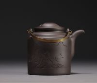 China - Yixing violet clay teapot in its box, 20th century.