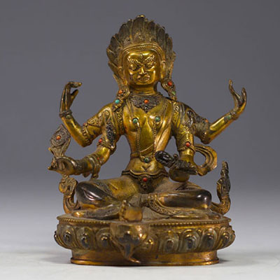 China, Tibet - Gilded bronze sculpture with stone inlays.