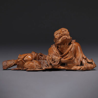 Japan - Boxwood sculpture of a reclining old man, late 19th century.