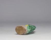 China - Green and yellow glazed ceramic parrot, perched on a rock, Qing period.