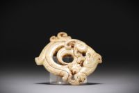 China - White jade pendant representing a phoenix.