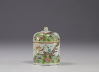 China - Small covered pot enclosing a cup in famille rose porcelain decorated with butterflies.