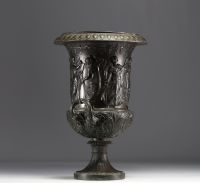 A Medici vase in bronzed brass with a black patina, decorated with a Bacchanalian frieze in the antique style, 19th century.