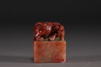 China - Carved stone seal surmounted by two lions, calligraphy, Qing period.