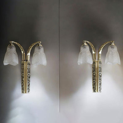 J. ROBERT (XIX-XX) Pair of Art Deco double sconces, pressed moulded glass globes and silvered bronze mounts with stylised decoration, unsigned.