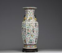 China - A rare pink family polychrome porcelain vase with relief decoration of domestic objects, fruit and floral motifs, hexagonal base, 19th century.