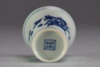 China - White-blue porcelain cup decorated with a rooster and hens.