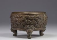 China, bronze perfume burner decorated with phoenixes in clouds, lion-headed feet, Qing period.