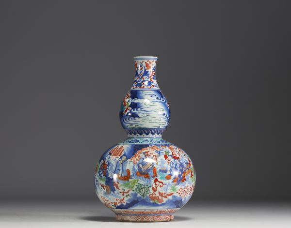 China - Double gourd vase decorated with mountain landscapes and figures.
