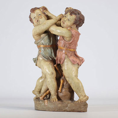 Polychrome terracotta sculpture in the shape of two boys called 