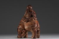 China - Buddha seated on an elephant, sculpture in patinated bamboo.