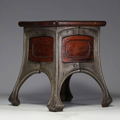 Art Nouveau stool with cast-iron base and mahogany seat.