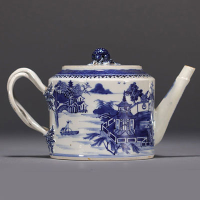 China - A white and blue porcelain teapot decorated with landscapes and a junk, 18th century.