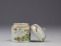 China - Small covered pot enclosing a cup in famille rose porcelain decorated with butterflies.