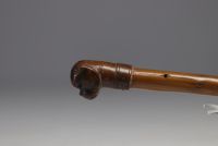 Set of three antique canes, one wooden knob with Bulldog head and two silver ones, one with eagle head.