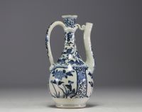 Japan - White and blue porcelain jug with floral decoration, 17th century.