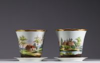 A set of two planters and an herbal tea pot in Brussels porcelain, 19th century.