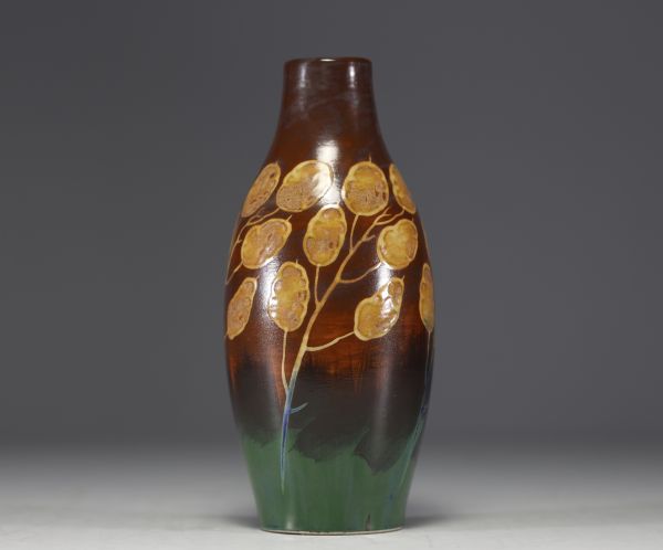 Charles CATTEAU (1880-1966) KERAMIS - Vase en grès émaillé au décor de monnaies du Pape sur fond brun et vert, signé.