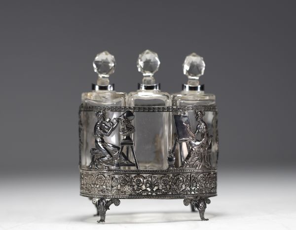 Three glass perfume bottles with silver mountings in the Empire style.