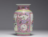 China - A Republic-period famille rose porcelain vase decorated with cartouche figures, flowers and insects (Apocryphal Qionlang mark)